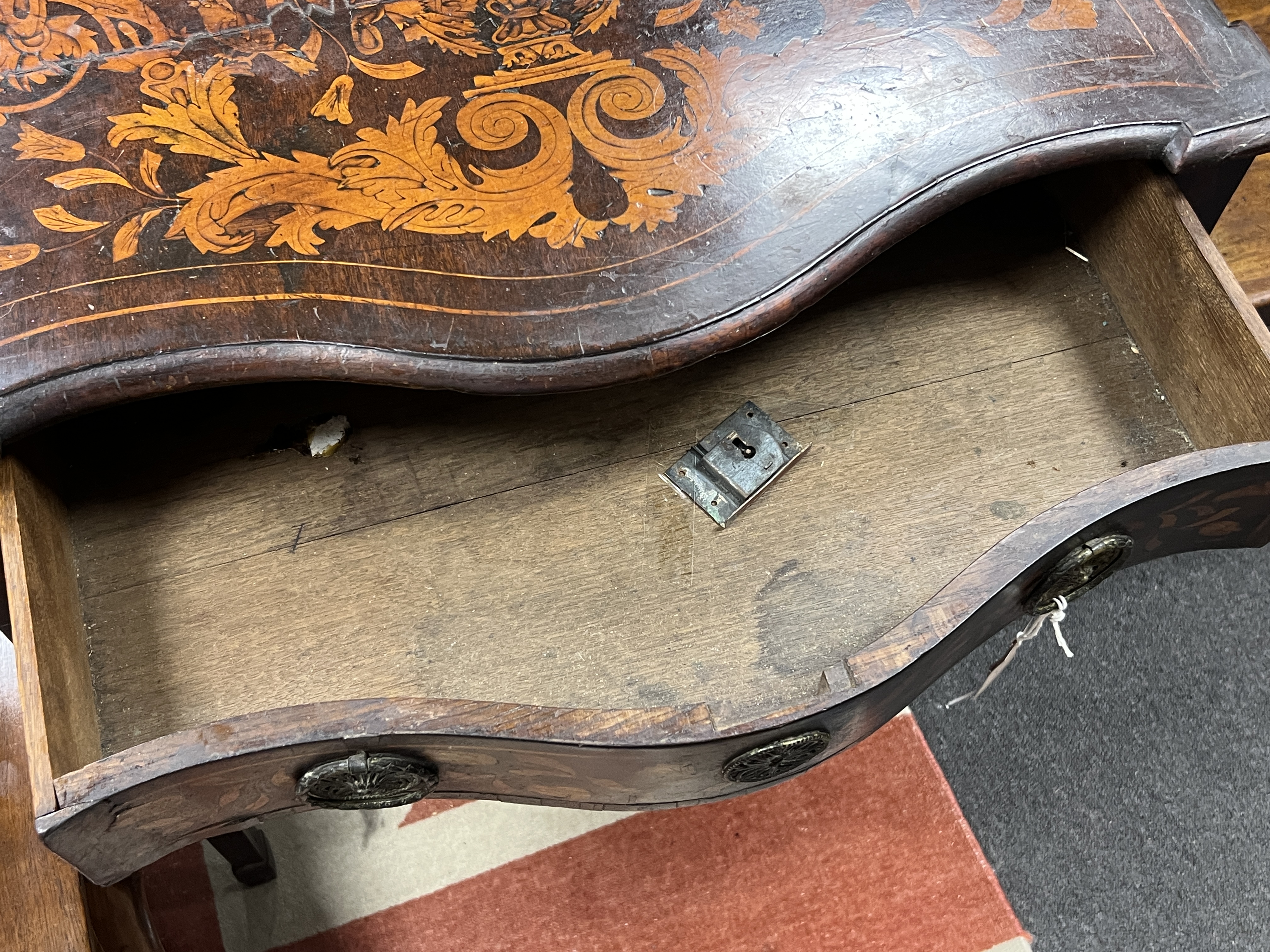 A late 18th century Dutch floral marquetry walnut serpentine side table, width 70cm, depth 45cm, height 74cm